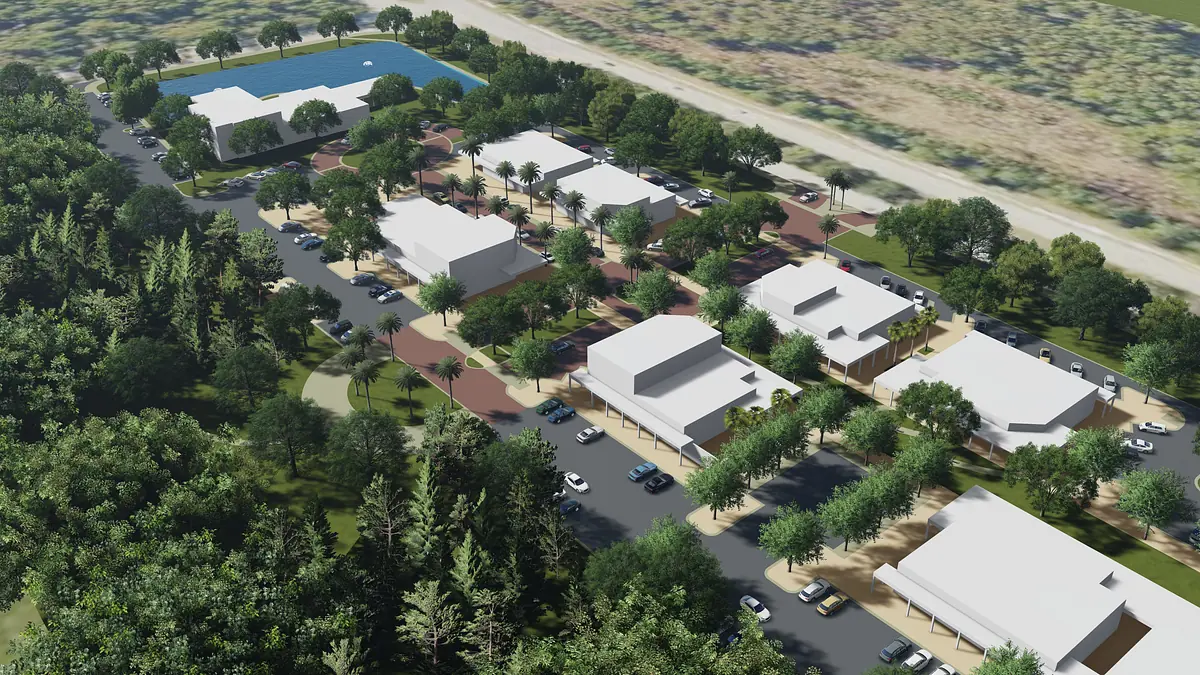 Aerial view of a residential community with buildings, pool, and landscaped areas.