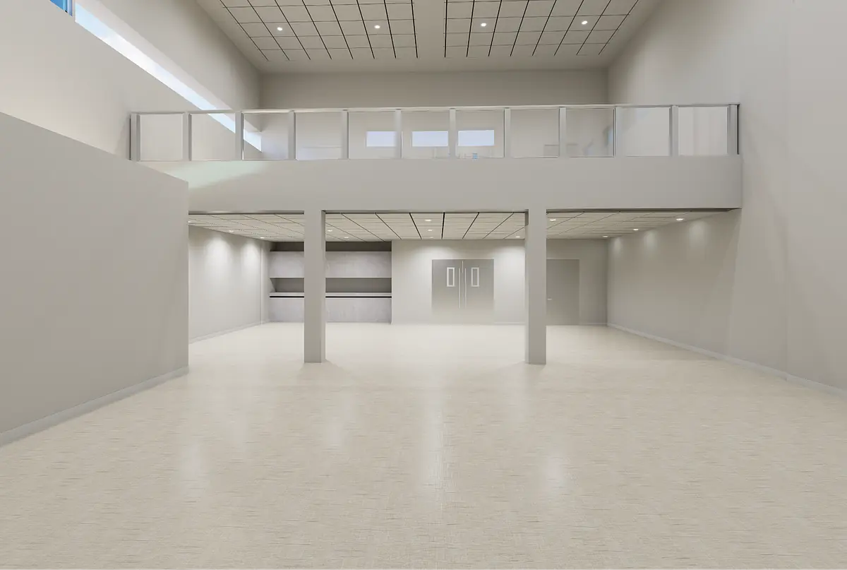 Open space with white walls, light flooring, second-floor balcony, and recessed lighting.