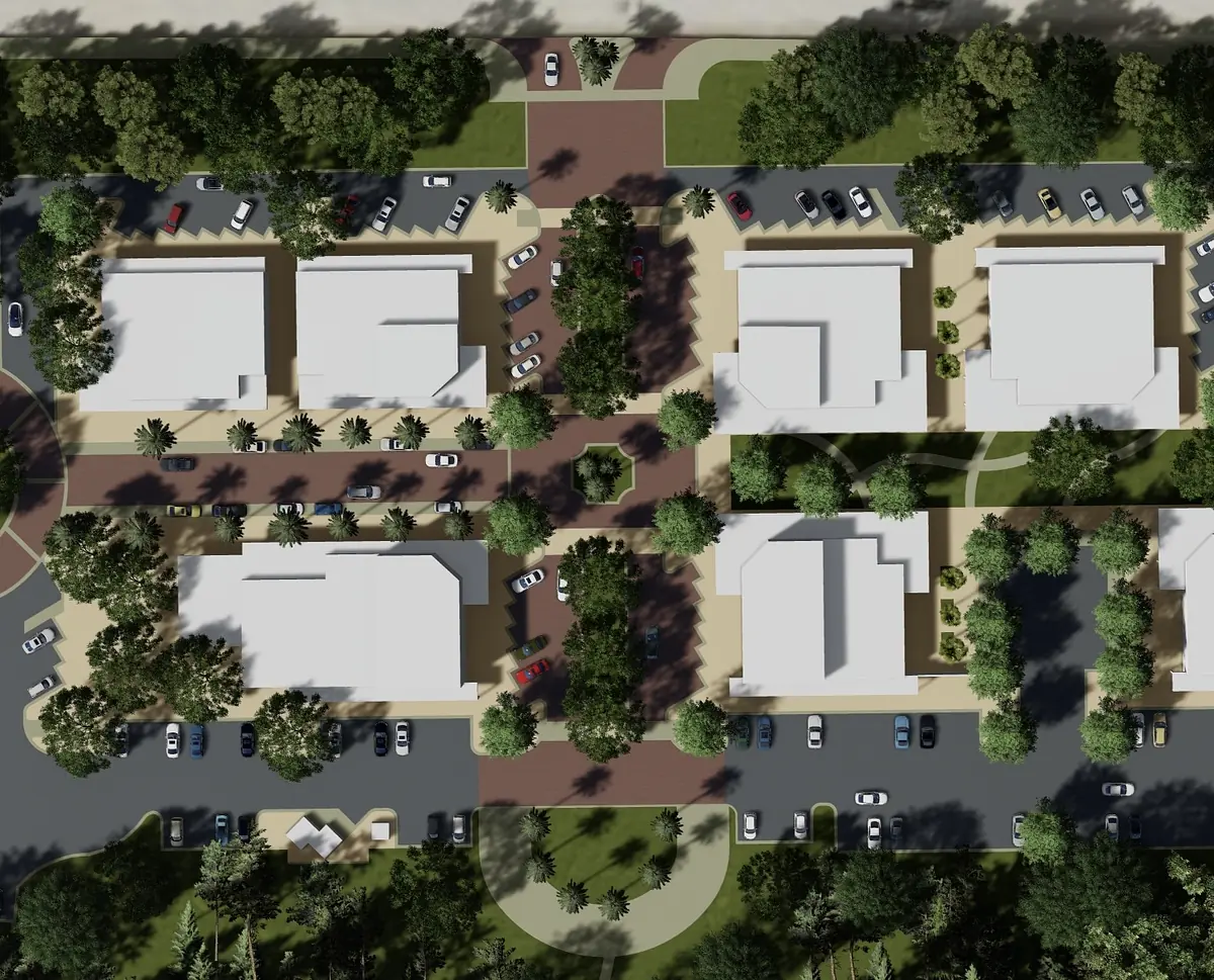 Aerial view of a residential area with buildings, pathways, parking, and landscaping.