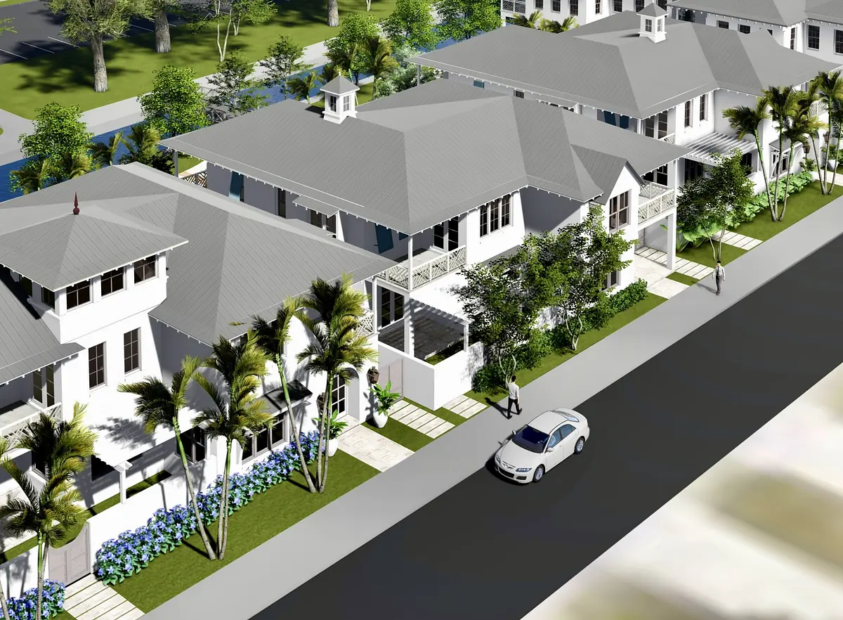 Exterior front view of houses with gabled roofs, porches, and landscaped gardens along a street.