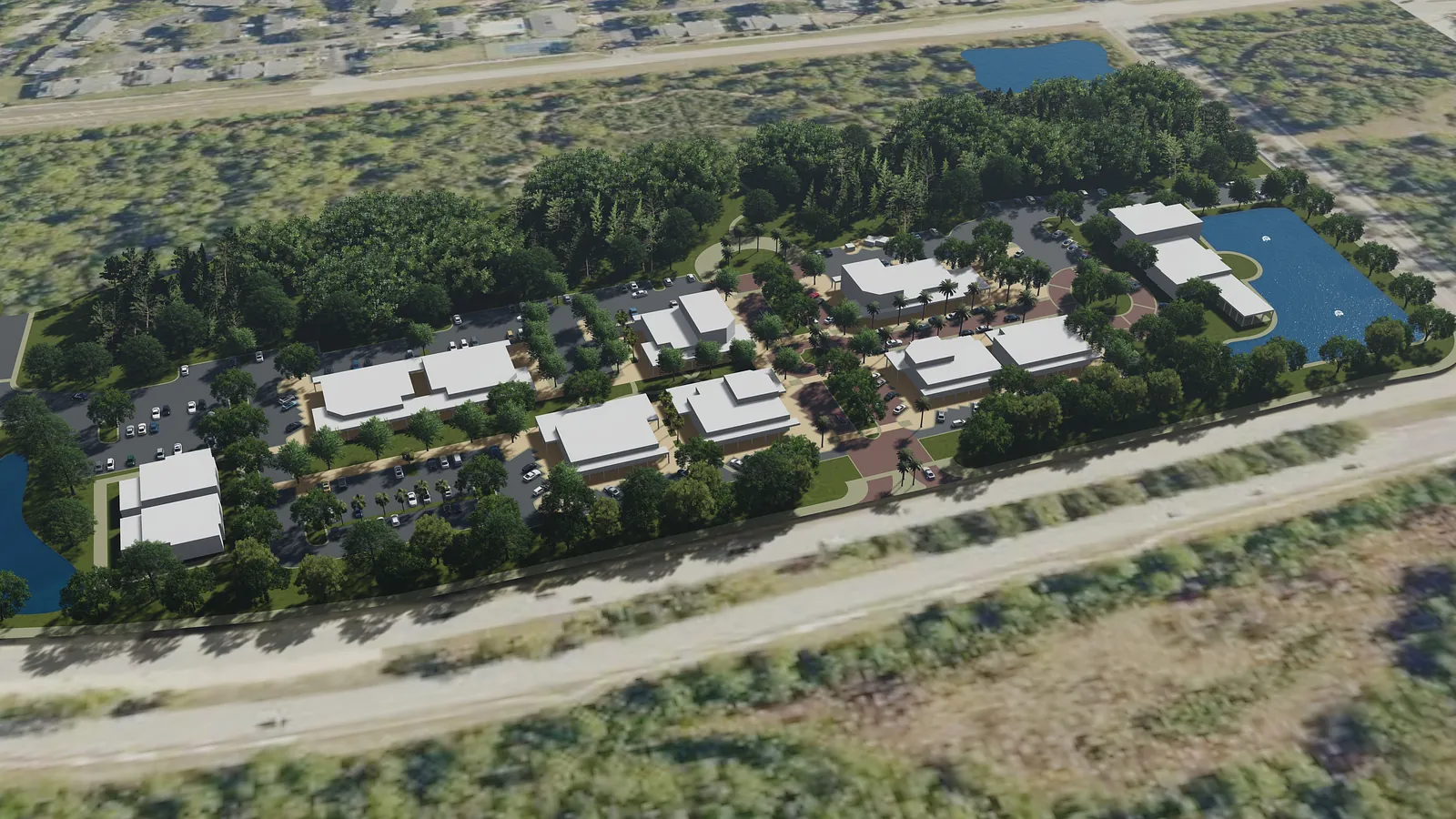 Aerial view of a residential complex with buildings, landscaping, pathways, and parking areas.