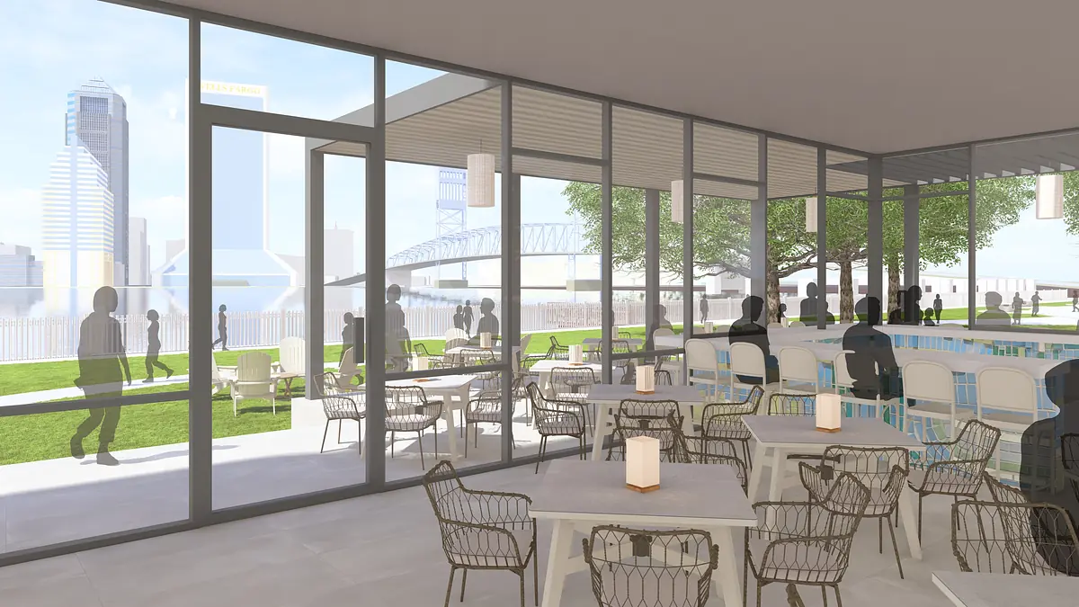Outdoor patio with round tables, chairs, bar counter, and glass windows overlooking greenery.
