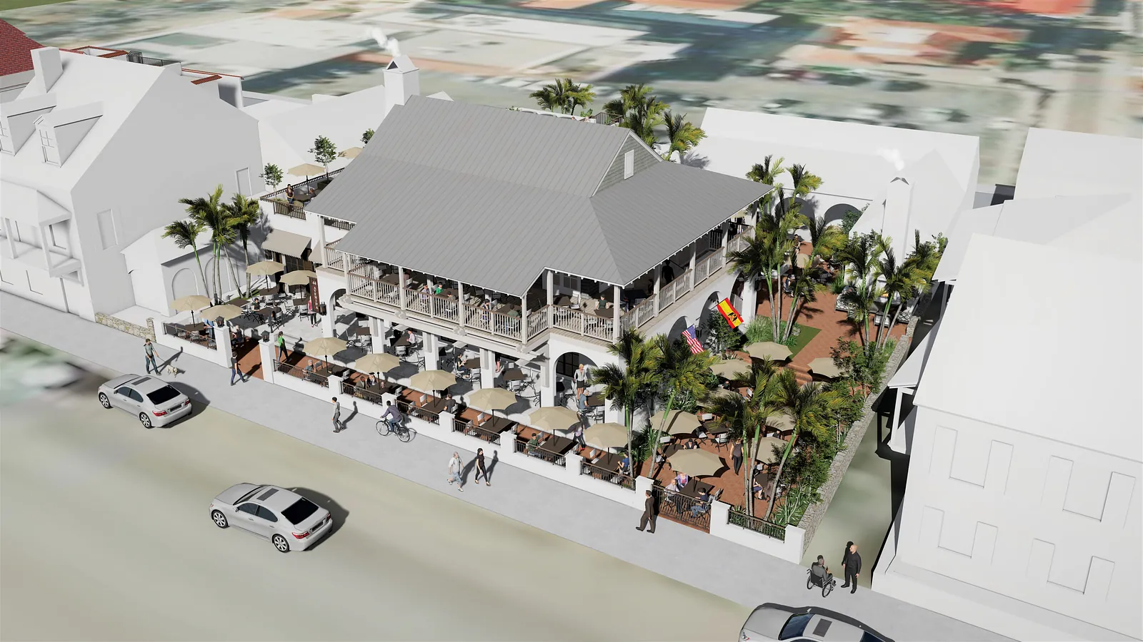 Exterior view of a two-story building with balcony, tables, umbrellas, and palm tree landscaping.