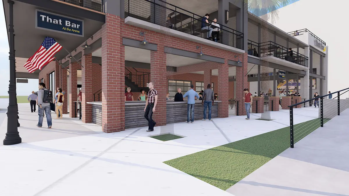 Exterior front view with brick building, outdoor bar, seating, grass, American flag, and lampposts.