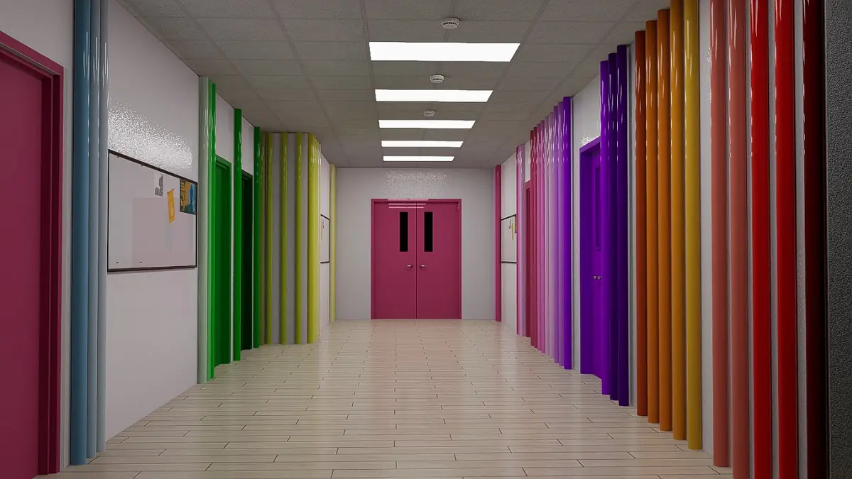 Hallway with colorful doors, white walls, grid ceiling, and bulletin boards.