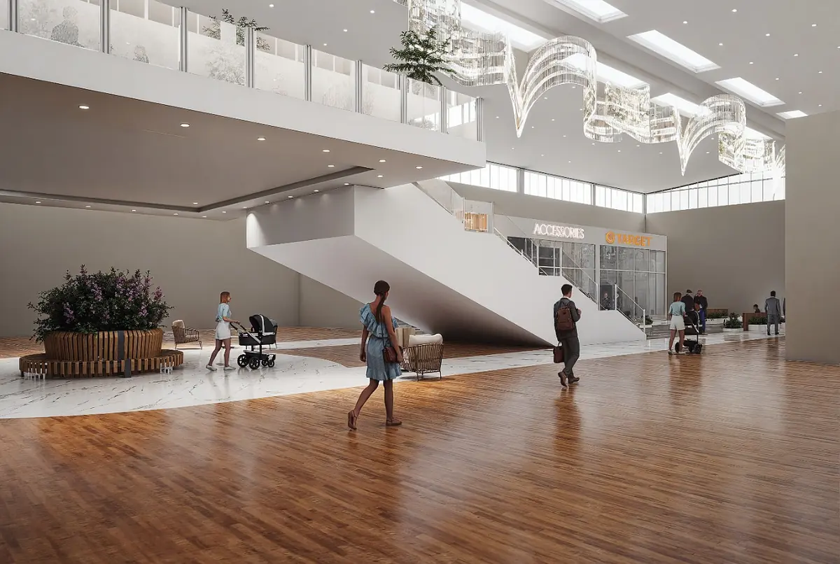 Open commercial space with wooden flooring, staircase, seating areas, planters, and natural light from large windows.