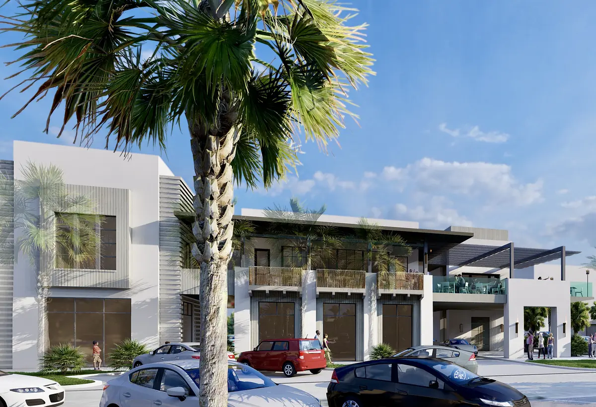 Modern building exterior with flat roof, large windows, palm trees, parking, and balcony areas with glass railings.