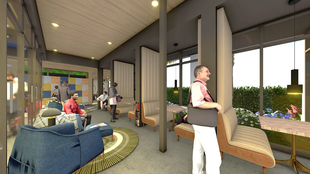 Communal space with blue armchairs, wooden benches, round rug, and wall partitions.