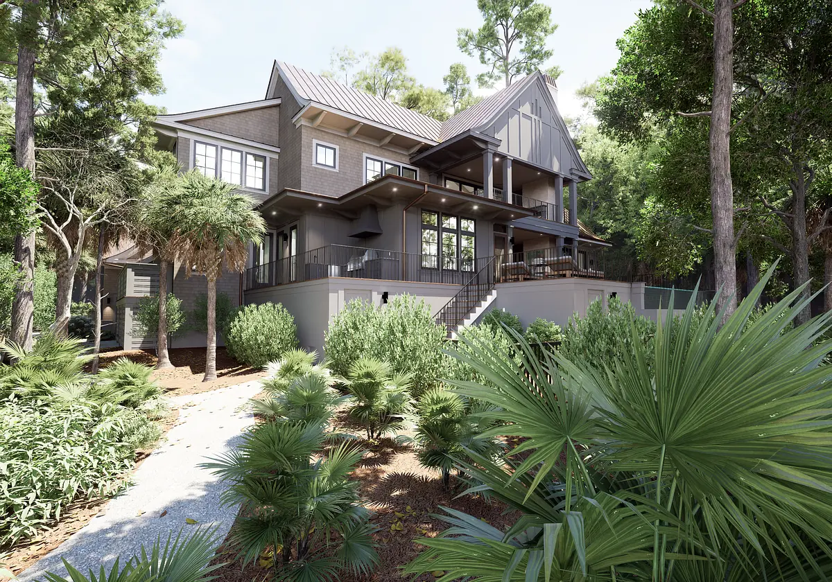 Exterior view of a multi-level house with large windows, staircase, patio, and surrounding greenery.