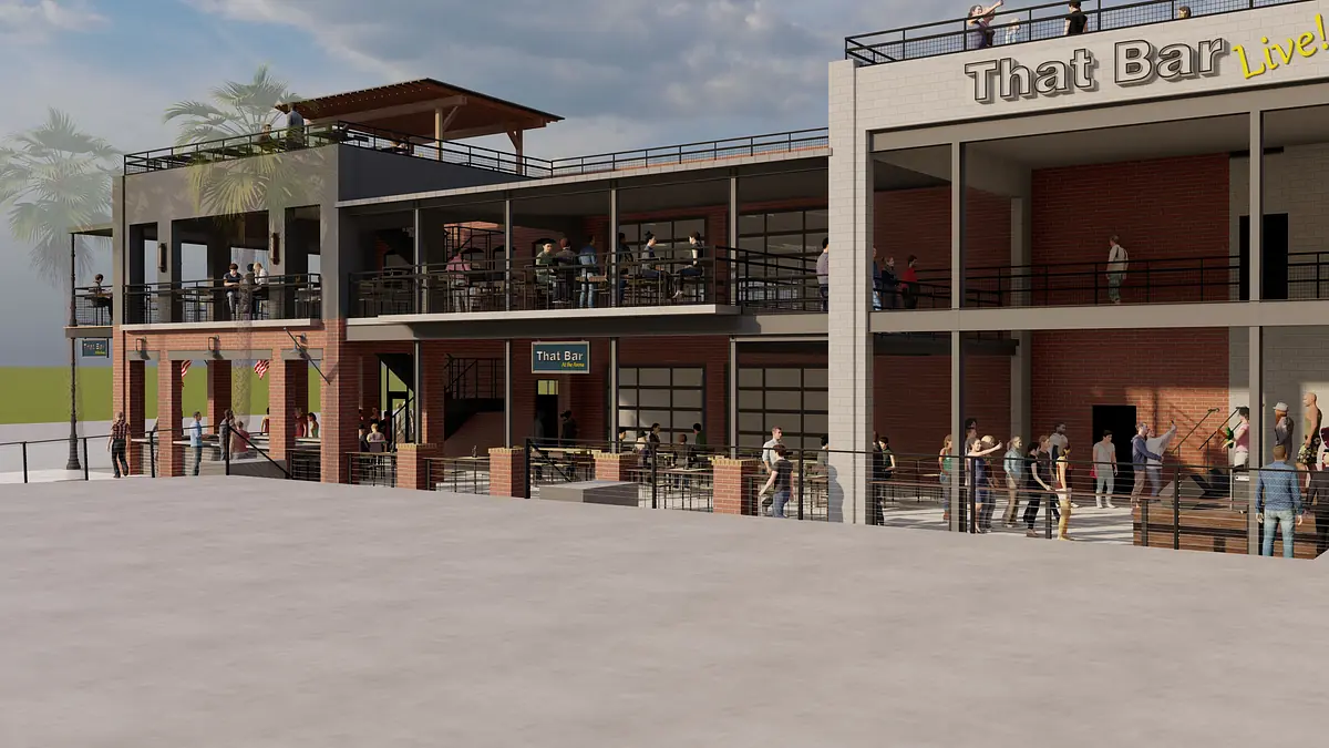 Exterior view of 'That Bar' building with brick walls, metal railings, terrace, and gathered crowd.