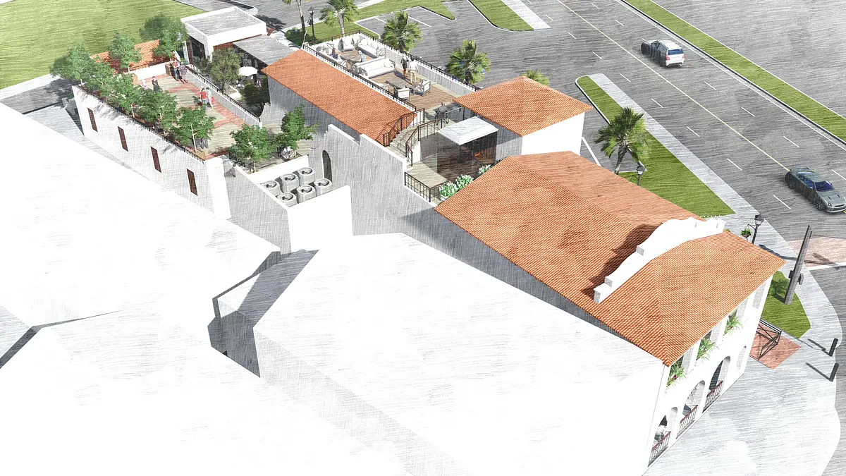 Exterior front view of building with terracotta roofs, palm trees, planters, and upper terrace with seating.