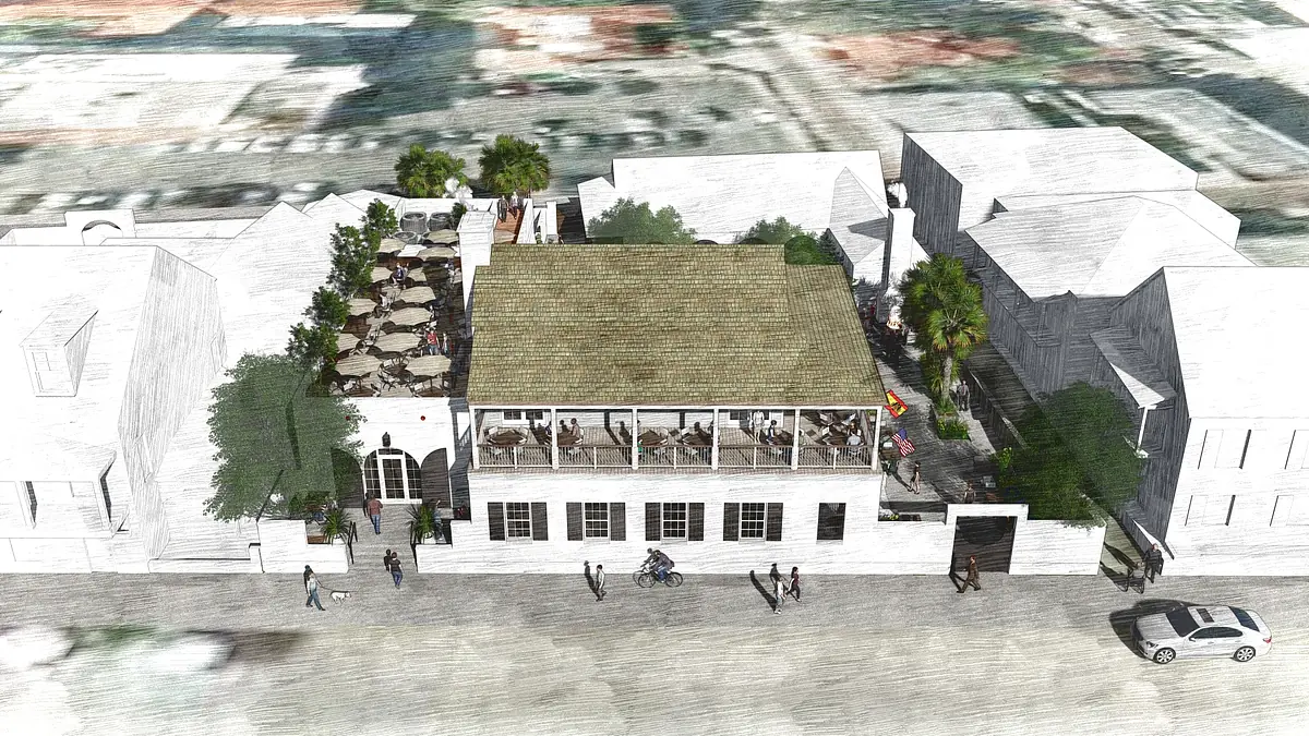 Exterior view of a building with terrace, palm trees, large windows, and urban surroundings.