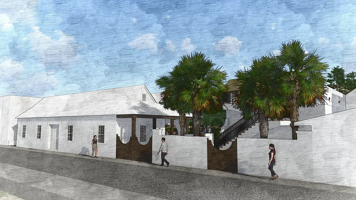 Exterior front view of a building with white walls, staircase, and palm trees, along a paved pathway