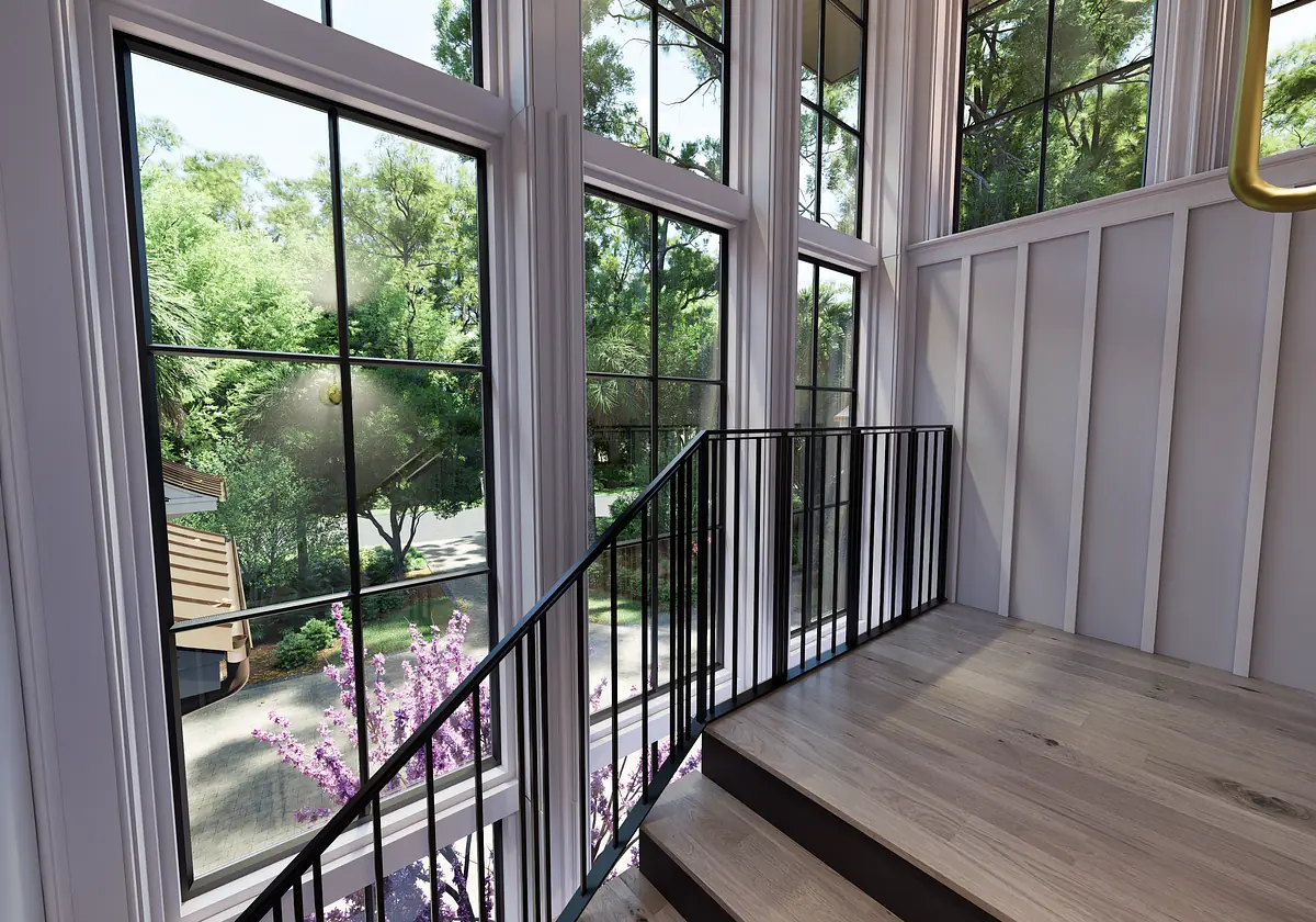 Hallway with staircase, large windows, wooden flooring, and white paneling.