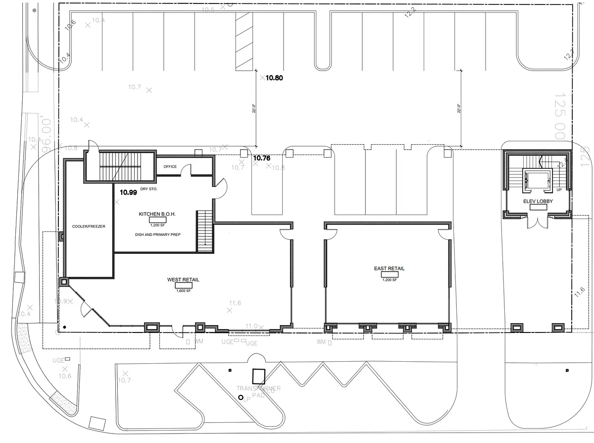 Floor plan layout showing office, kitchen, and two retail spaces with measurements.