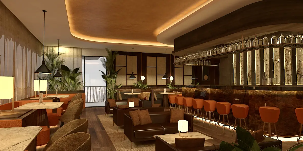 Lounge area with brown leather sofas, wooden tables, orange bar stools, greenery, and a bar with glassware.