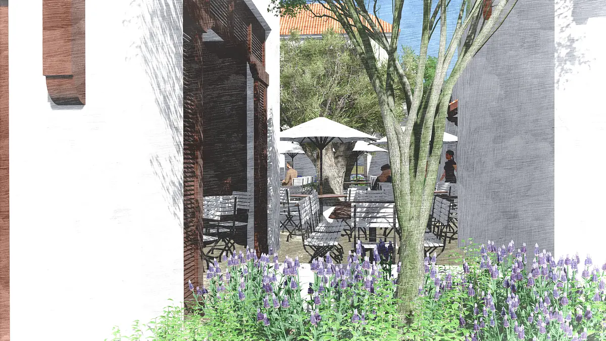 Patio area with tables, chairs, umbrellas, tree, and flowering plants.