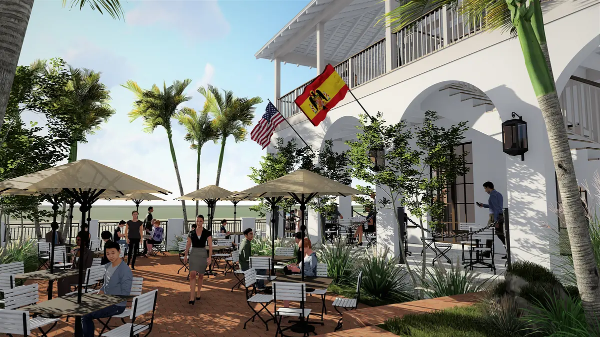 Patio area with dining tables, umbrellas, palm trees, and flags, featuring guests and a waiter.
