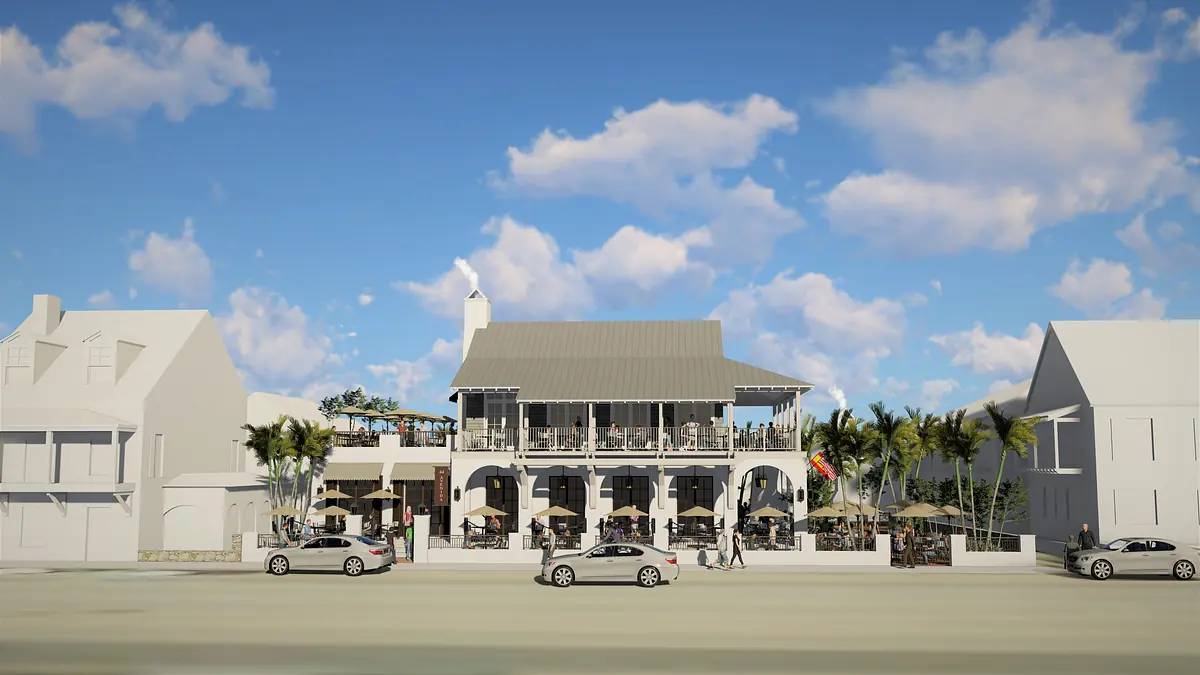 Exterior view of a building with gray roof, arches, balcony, outdoor seating, and palm trees.
