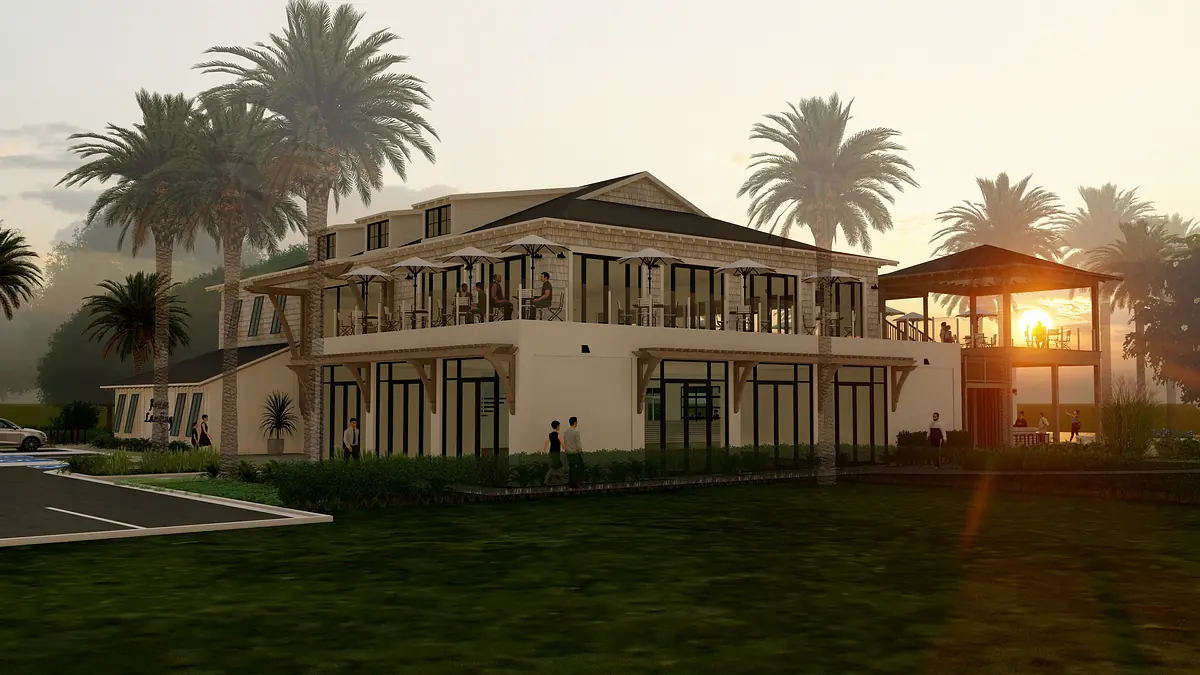 Exterior view of a multi-level building with large windows, porches, and palm trees at sunset.