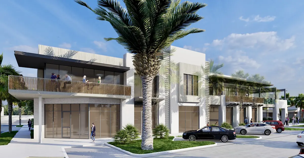 Modern building facade with glass windows, balcony, palm trees, and parked vehicles.
